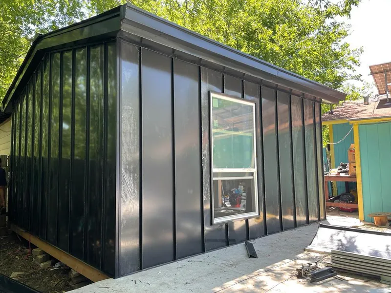 Black standing seam metal wall panels for Roof Inspection in Blythe